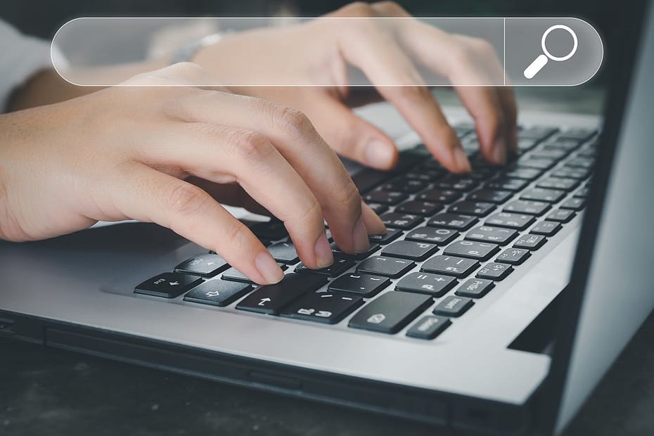 Woman performing a Trademark search on a laptop